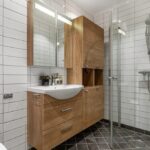 24 inch glass shower door in compact modern bathroom